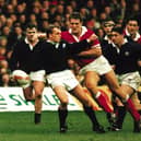Gregor Townsend takes the brunt of the Welsh charge in the Scotland v Wales rugby game, 19 Feb 1996