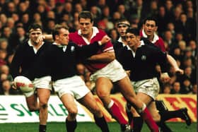 Gregor Townsend takes the brunt of the Welsh charge in the Scotland v Wales rugby game, 19 Feb 1996