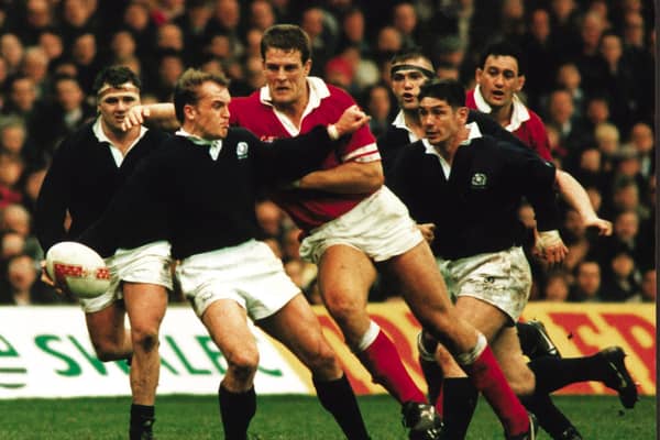Gregor Townsend takes the brunt of the Welsh charge in the Scotland v Wales rugby game, 19 Feb 1996