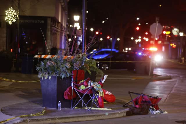 Toppled chairs are seen among holiday decorations in downtown Waukesha, Wis., after an SUV ploughed into a Christmas parade injuring dozens of people Sunday, Nov 21. 2021. Photo: AP Photo/Jeffrey Phelps.