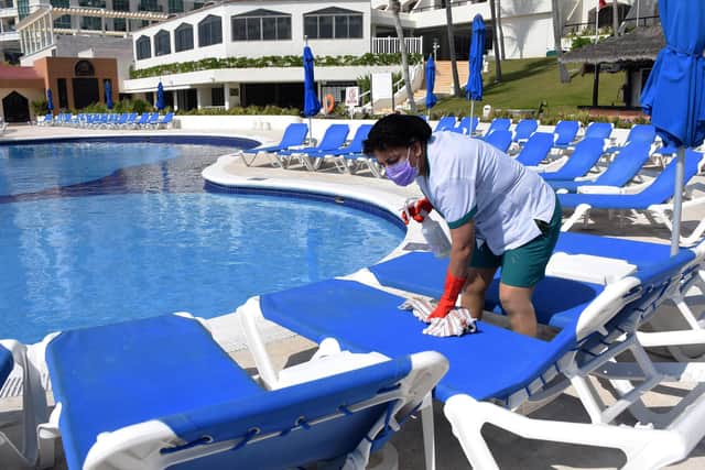 Which? is urging those considering a package holiday this summer to read the small print before booking. Picture: Elizabeth Ruiz/AFP via Getty Images.