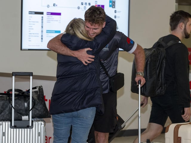 Reunited: Passengers arrive home on Emirates flight