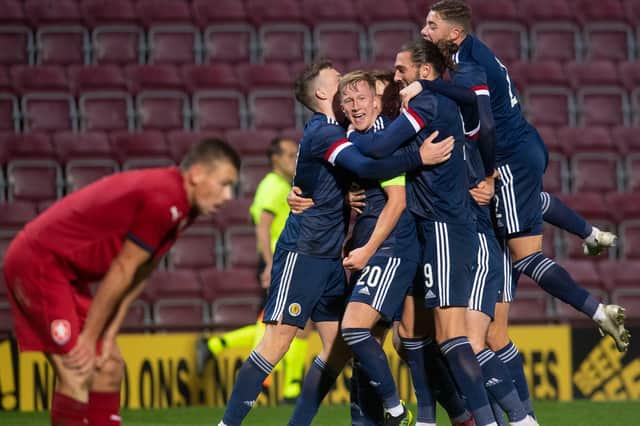 The Scotland players celebrate Ross McCrorie's goal to make it 2-0.