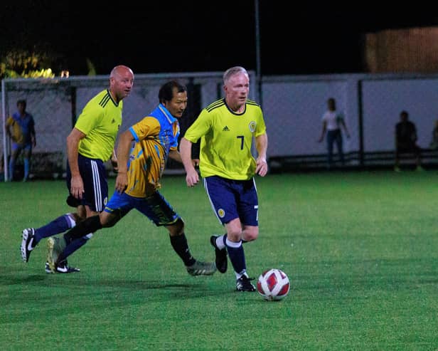 Craig Meikle, main left with Davie Taylor, right, playing for Scotland against hosts Thailand