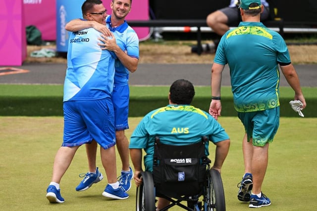 Garry Brown and Kevin Wallace of Team Scotland celebrate after winning thegold medal match in the lawn bowls Para Men's Pairs B6-B8.