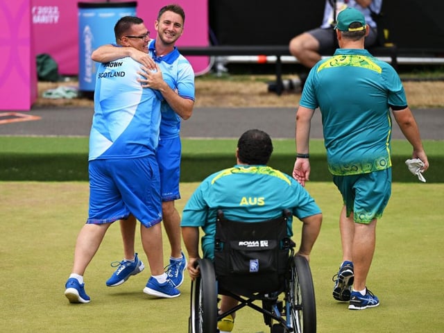 Garry Brown and Kevin Wallace of Team Scotland celebrate after winning thegold medal match in the lawn bowls Para Men's Pairs B6-B8.