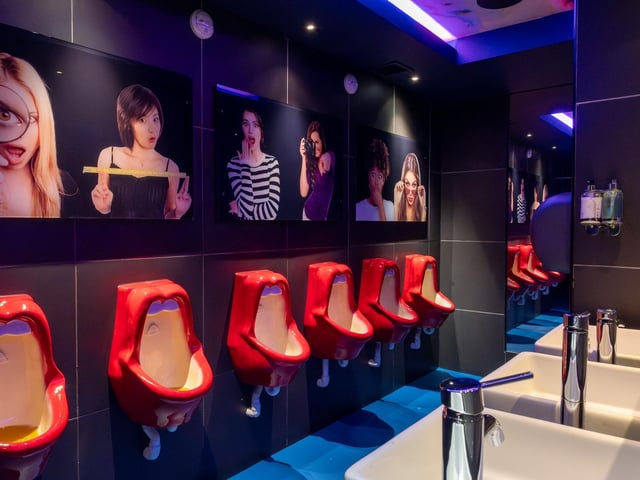 Whereas in the men's loos there's 'juicy lip urinals'.