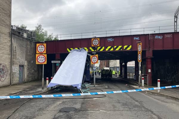 The roof of the double-decker bus was sliced off after the vehicle collided with the low bridge. Picture: Network Rail