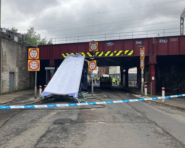 The roof of the double-decker bus was sliced off after the vehicle collided with the low bridge. Picture: Network Rail