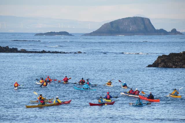 Volunteers from Lothian Sea Kayak Club paddle towards Lamb Island to track down its invading vermin