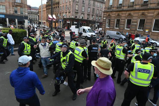 Police attempt to control violent behaviour as No Evictions Glasgow protest was interrupted by far-right groups in George Square