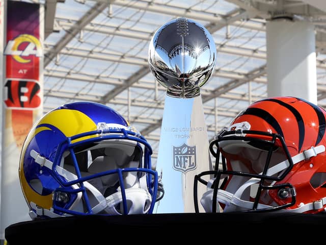 Helmets of the Los Angeles Rams and Cincinnati Bengals sit in front of the Lombardi Trophy as NFL Commissioner Roger Goodell (not pictured) addresses the media at the NFL Network's Champions Field at the NFL Media Building on the SoFi Stadium campus in Inglewood, California. (Photo by Rob Carr/Getty Images)
