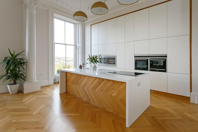 The kitchen is fitted with high end units and integrated appliances and there is a breakfast bar for casual dining