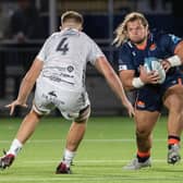 Pierre Schoeman drives at Dragons' Ben Carter during Edinburgh's URC win at the DAM Health Stadium.  (Photo by Ross Parker / SNS Group)