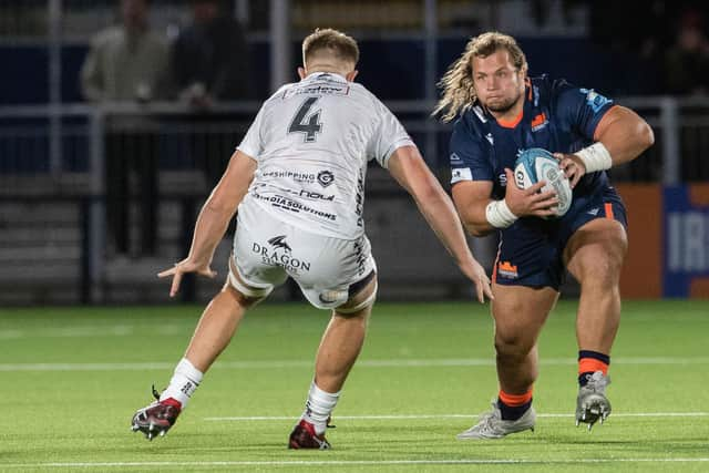 Pierre Schoeman drives at Dragons' Ben Carter during Edinburgh's URC win at the DAM Health Stadium.  (Photo by Ross Parker / SNS Group)