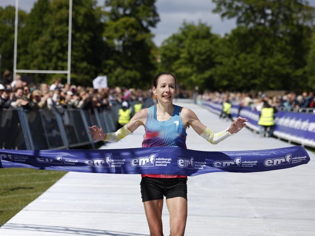 The winner of the female race crosses the finishing line
