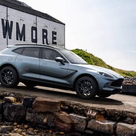 The DBX Bowmore Edition pictured at the Bowmore Distillery on Islay. Only 18 of the model, styled by Aston Martin's Q by Aston MArtin personalisation service will be released.
