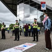 Activists from climate groups and Palestine solidarity groups demonstrate outside of the SEC (Photo by ANDY BUCHANAN/AFP via Getty Images)