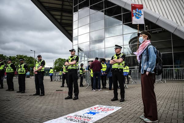 Activists from climate groups and Palestine solidarity groups demonstrate outside of the SEC (Photo by ANDY BUCHANAN/AFP via Getty Images)