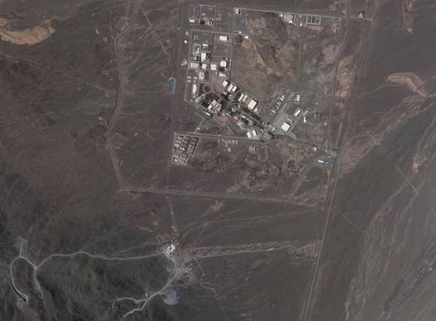 This satellite image from Planet Labs PBC shows Iran's underground Natanz nuclear site, as well as ongoing construction to expand the facility in a nearby mountain to the south, near Natanz, Iran, May 9, 2022.