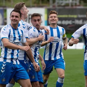 Kilmarnock's players celebrate after Kevin Holt's own goal gives them the lead.  (Photo by Sammy Turner / SNS Group)
