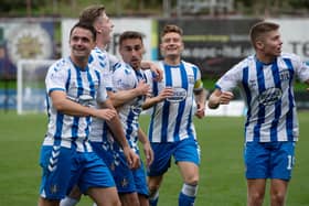 Kilmarnock's players celebrate after Kevin Holt's own goal gives them the lead.  (Photo by Sammy Turner / SNS Group)