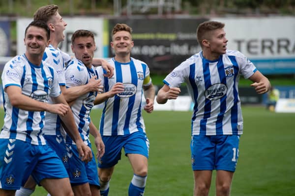 Kilmarnock's players celebrate after Kevin Holt's own goal gives them the lead.  (Photo by Sammy Turner / SNS Group)