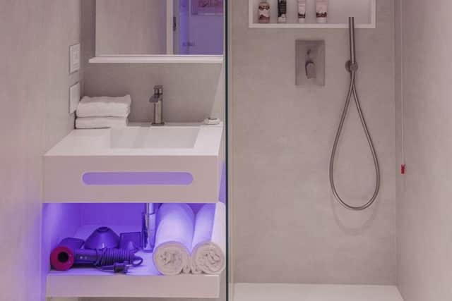 The ensuite bathrooms have walk-in rain showers and sleek open storage. Pic: Contributed