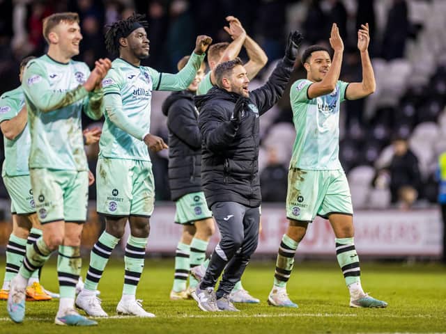 Hibs manager Lee Johnson and his players celebrate the win over St Mirren.