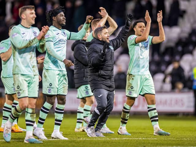 Hibs manager Lee Johnson and his players celebrate the win over St Mirren.