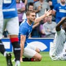 Ross County's Jordy Hiwula appeals to the referee after he is brought down by Rangers defender James Sands. (Photo by Rob Casey / SNS Group)