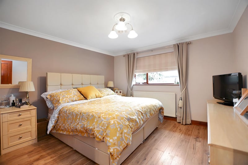 A good-sized bedroom, with radiator, wood-effect laminate floor, coving to ceiling and double glazed window to the rear elevation.