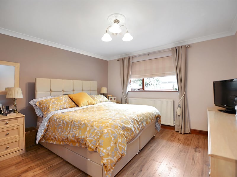 A good-sized bedroom, with radiator, wood-effect laminate floor, coving to ceiling and double glazed window to the rear elevation.