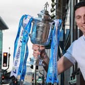 Former Celtic captain Scott Brown holds up the Scottish Gas Scottish Cup. Pic: Steve Welsh