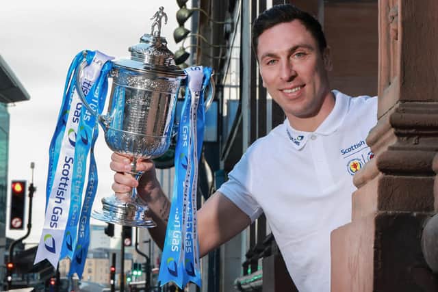 Former Celtic captain Scott Brown holds up the Scottish Gas Scottish Cup. Pic: Steve Welsh