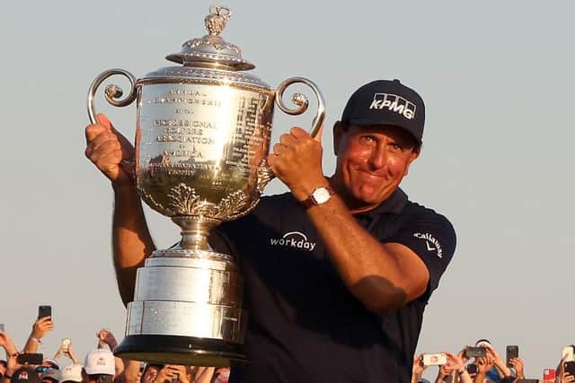 Phil Mickelson celebrates with the Wanamaker Trophy after becoming golf's olfest major champion at 50 by winning the 2021 US PGA Championship at KIawah Island on Sunday. Picture: Jamie Squire/Getty Images.
