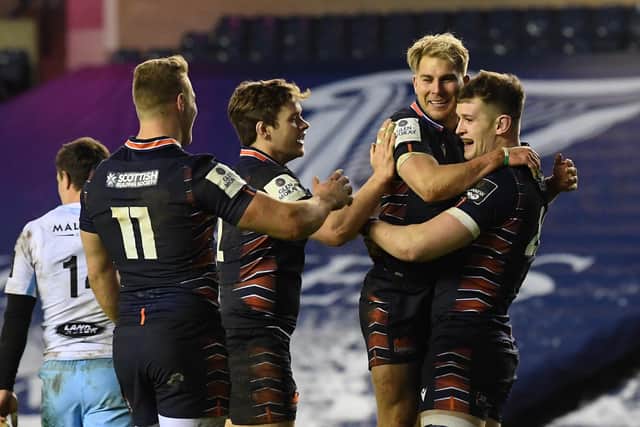 Edinburgh players celebrate Magnus Bradbury's try against Glasgow Warriors.