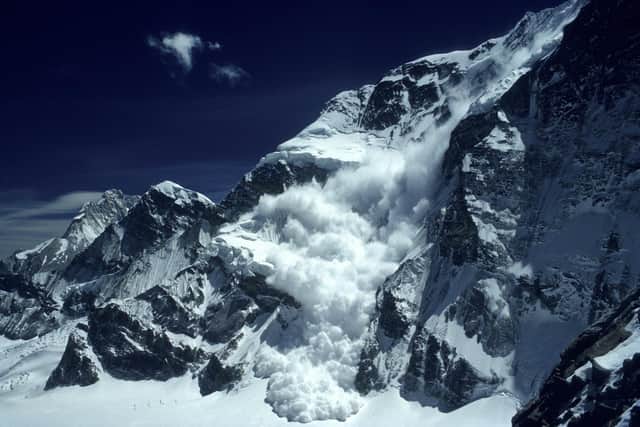 An avalanche crahess down the neigbouring peak Shartse