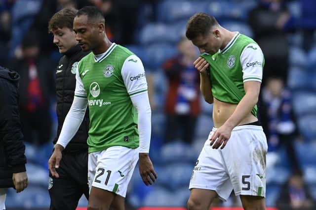 Hibs' Jordan Obita, left, and Will Fish trudge off the Ibrox pitch after the 4-0 defeat by Rangers.