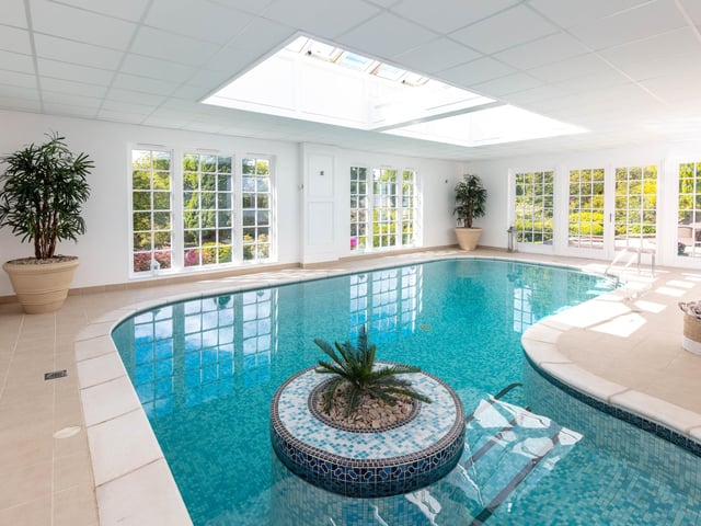 Interior: The 4,800-sq ft floor space features a drawing room, dining room, kitchen with Aga, and a leisure complex with swimming pool, sauna and French doors opening to the garden. The main bedroom, upstairs, has an ensuite and balcony and the rest are good-sized.