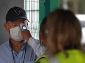 England coach Eddie Jones has his temperature taken before a match. Picture: David Rogers/Getty Images