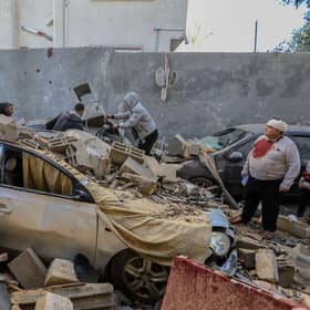 People in Rafah, Gaza, inspect damage caused to their homes following Israeli air strikes, on Wednesday. Whilst a new ceasefire deal is negotiated between Israel and Hamas, there are mounting concerns over an IDF ground invasion of Gaza's southern city of Rafah where some 1.4 million internally displaced Palestinians are sheltering, and the UN warns of a "large scale" loss of life.
