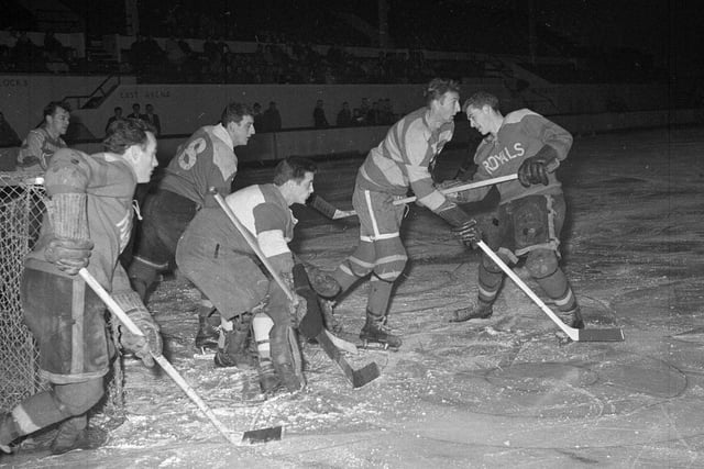 The Murrayfield Royals ice hockey team are pictured taking on the Fife Flyers at Murrayfield Ice Rink in November 1962.