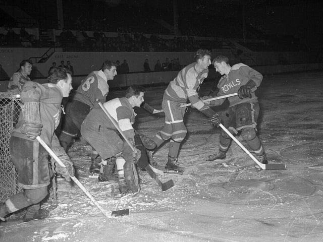 The Murrayfield Royals ice hockey team are pictured taking on the Fife Flyers at Murrayfield Ice Rink in November 1962.