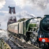 The Flying Scotsman passes over the Forth Bridge near North Queensferry in Fife. Picture: Jane Barlow/PA Wire