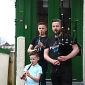 Finlay MacDonald, newly appointed director of the National Piping Centre, practises for the Pipe Up for Key Workers tribute with sons Elliott (10) and Fionn (8) on chanter