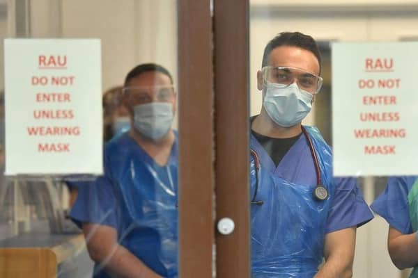 NHS staff wait to receive Covid-19 patients.