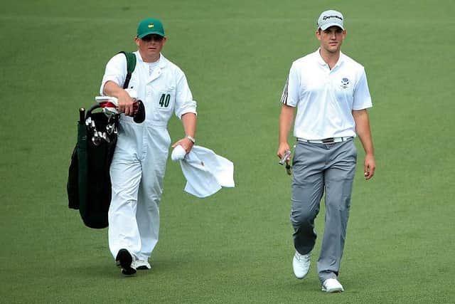 Bradley Neil and caddie Philip McKenna walk on the second hole during the first round of the 2015 Masters. Picture: Andrew Redington/Getty Images.
