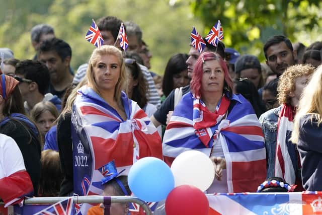 Royal fans take up their spots on the Mall ahead of the Trooping the Colour ceremony on day one of the Platinum Jubilee celebrations. Picture: Andrew Matthews/PA Wire