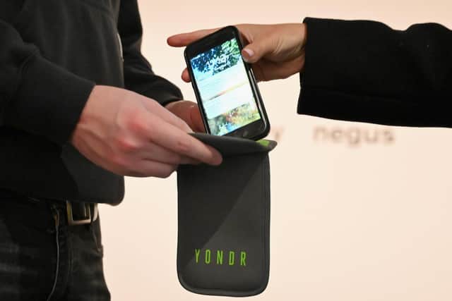 Mobile phones are locked into 'Yondr' pouches before people enter a phone-free zone (Picture: Angela Weiss)